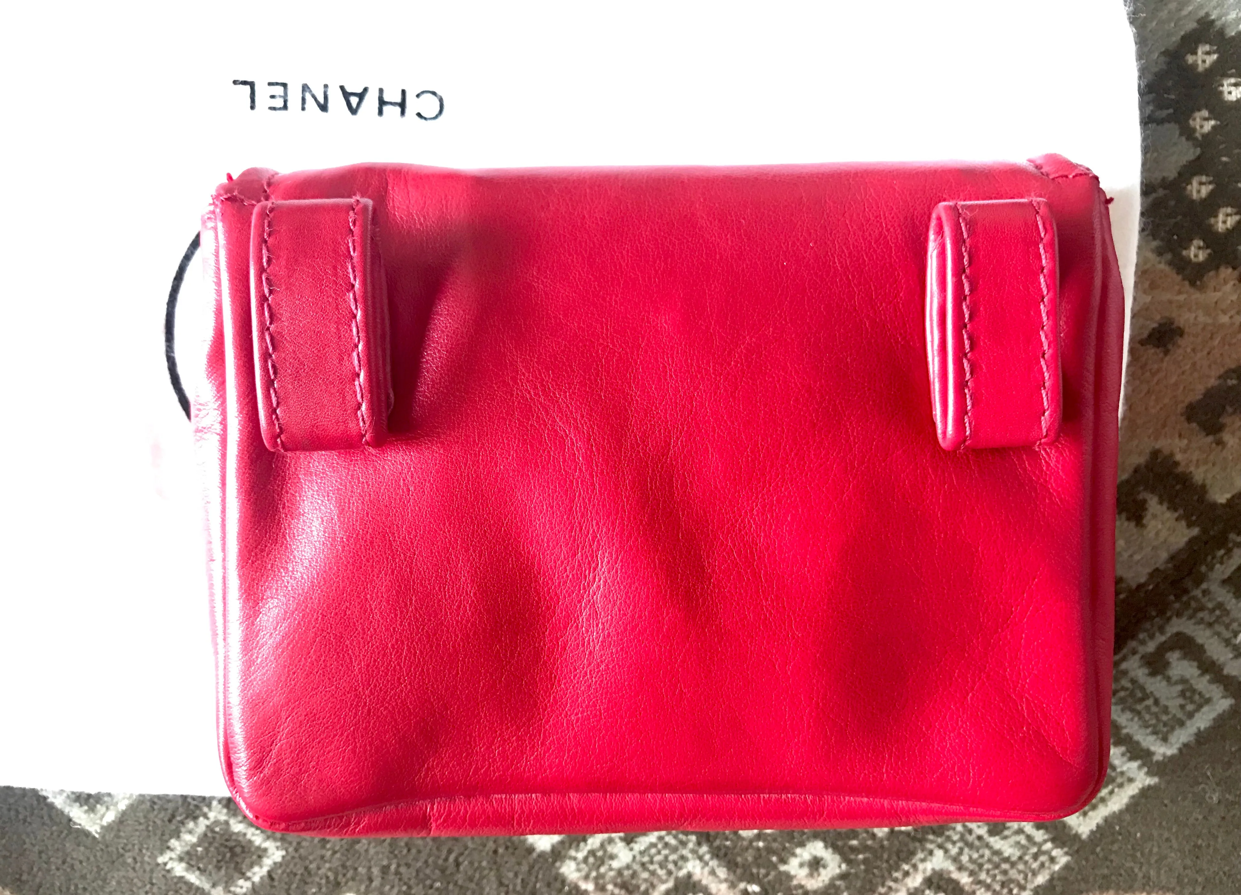 Vintage CHANEL red leather belt bag, fanny pack with detachable chain belt and CC stitch mark on flap.  Fits 29.5" through 32.8"