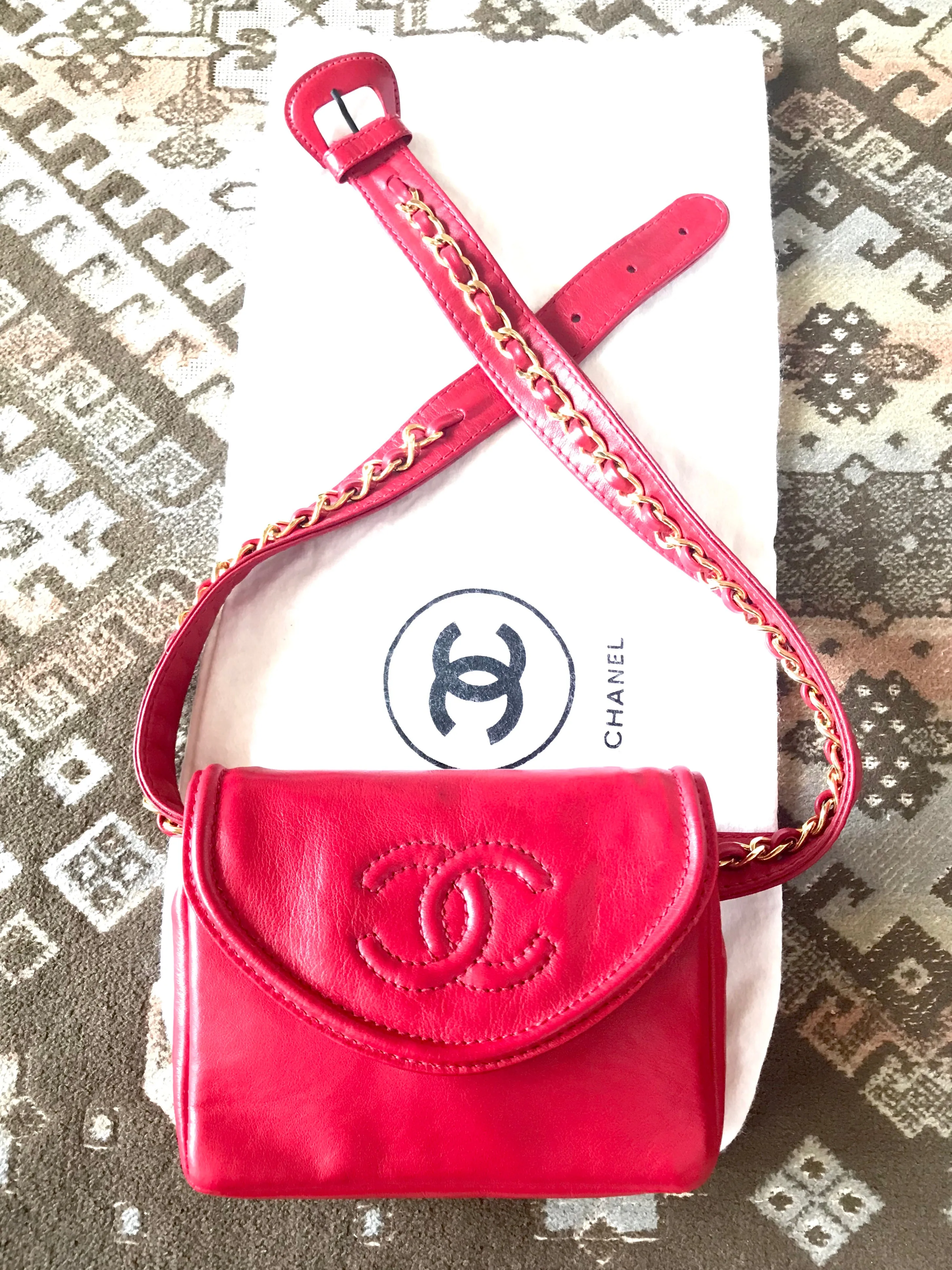 Vintage CHANEL red leather belt bag, fanny pack with detachable chain belt and CC stitch mark on flap.  Fits 29.5" through 32.8"