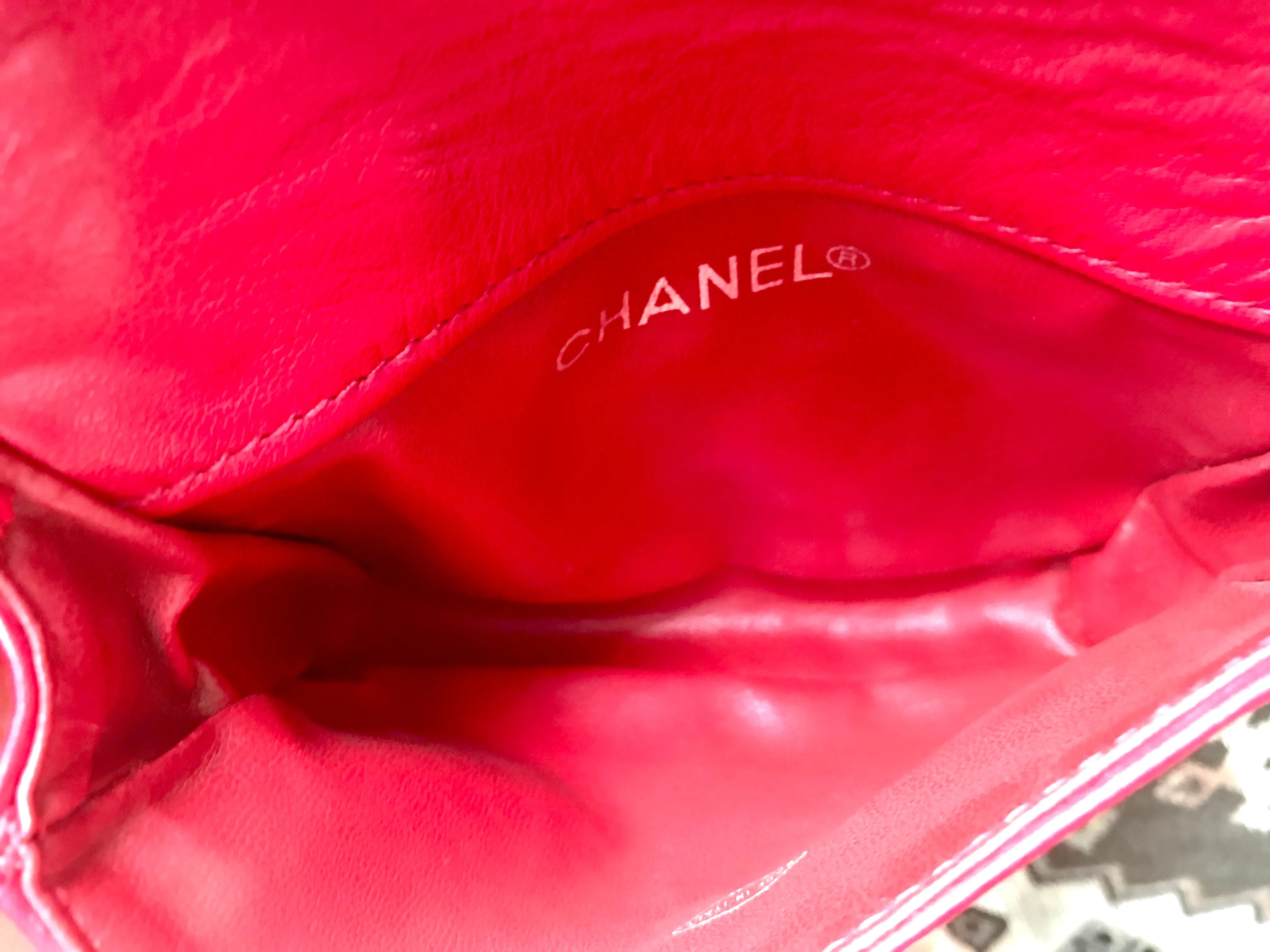 Vintage CHANEL red leather belt bag, fanny pack with detachable chain belt and CC stitch mark on flap.  Fits 29.5" through 32.8"