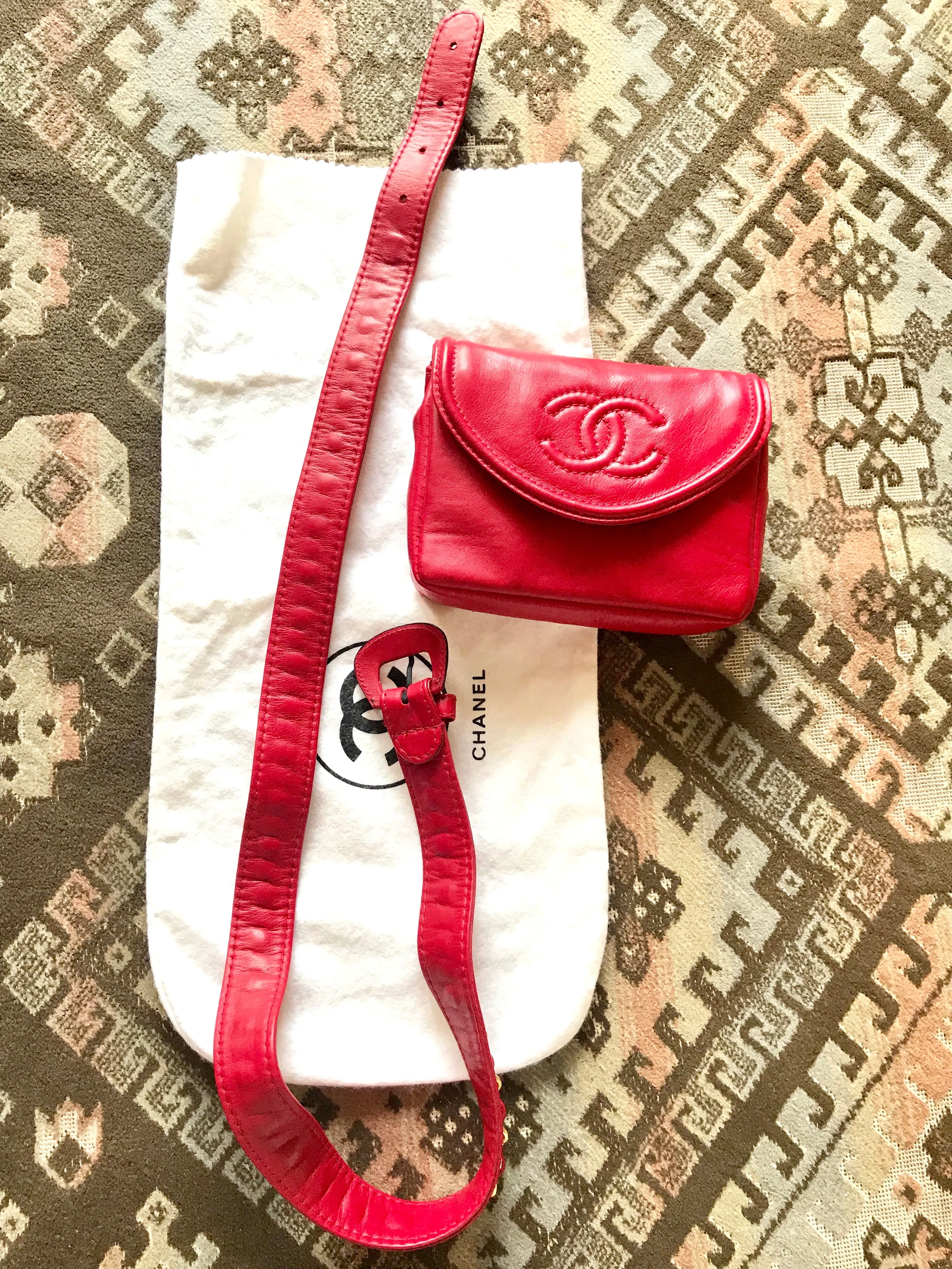 Vintage CHANEL red leather belt bag, fanny pack with detachable chain belt and CC stitch mark on flap.  Fits 29.5" through 32.8"