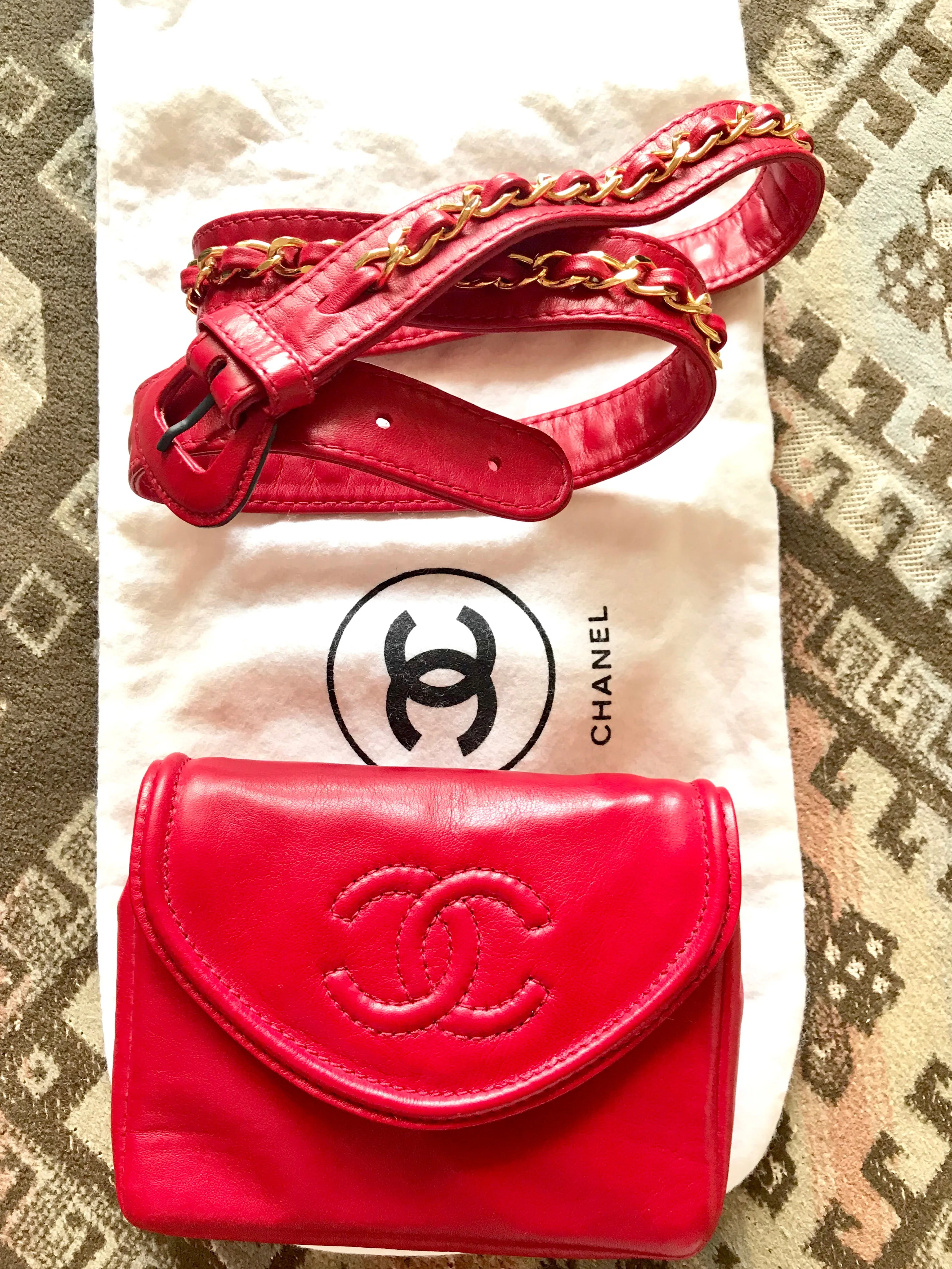 Vintage CHANEL red leather belt bag, fanny pack with detachable chain belt and CC stitch mark on flap.  Fits 29.5" through 32.8"