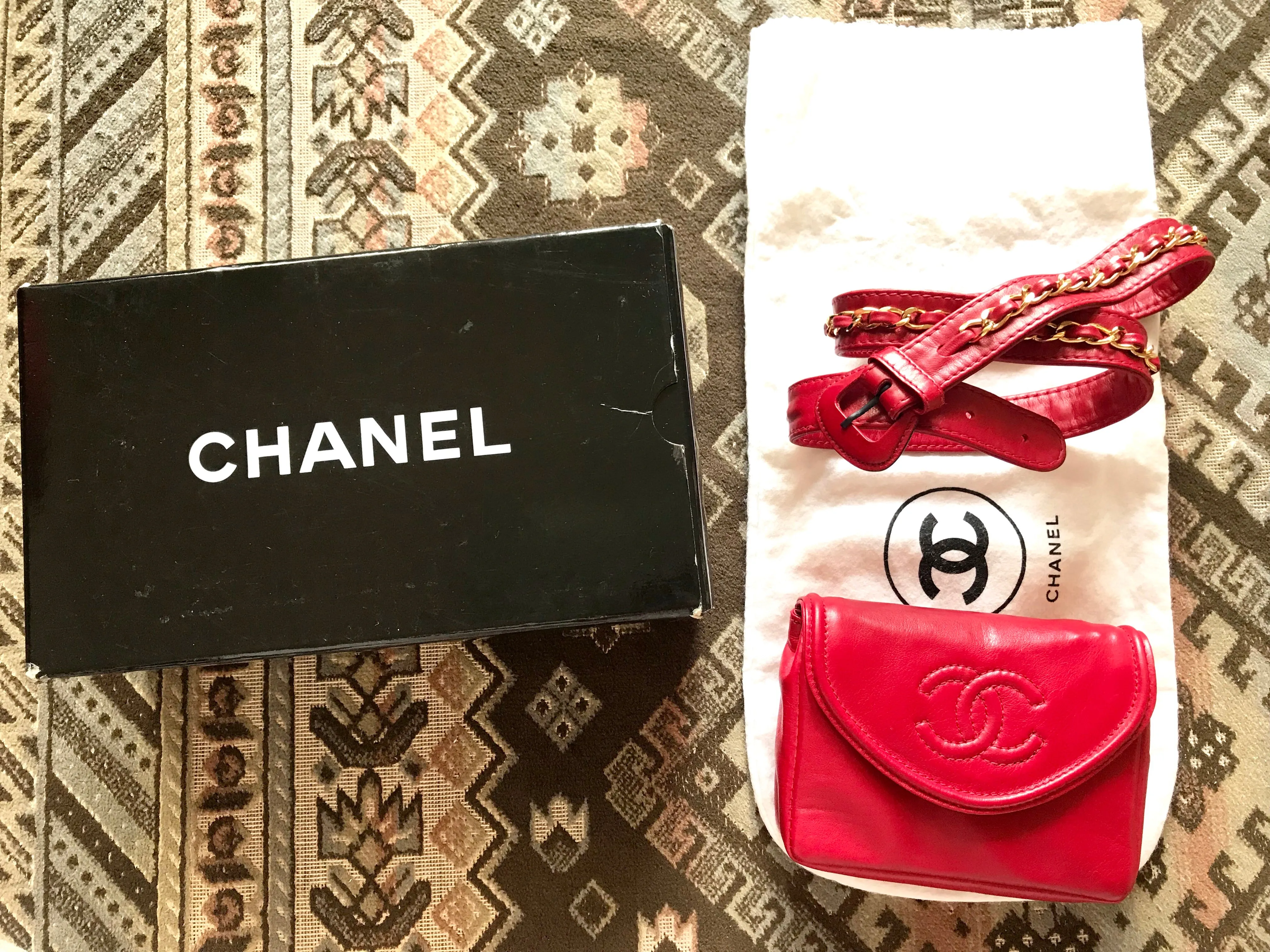 Vintage CHANEL red leather belt bag, fanny pack with detachable chain belt and CC stitch mark on flap.  Fits 29.5" through 32.8"